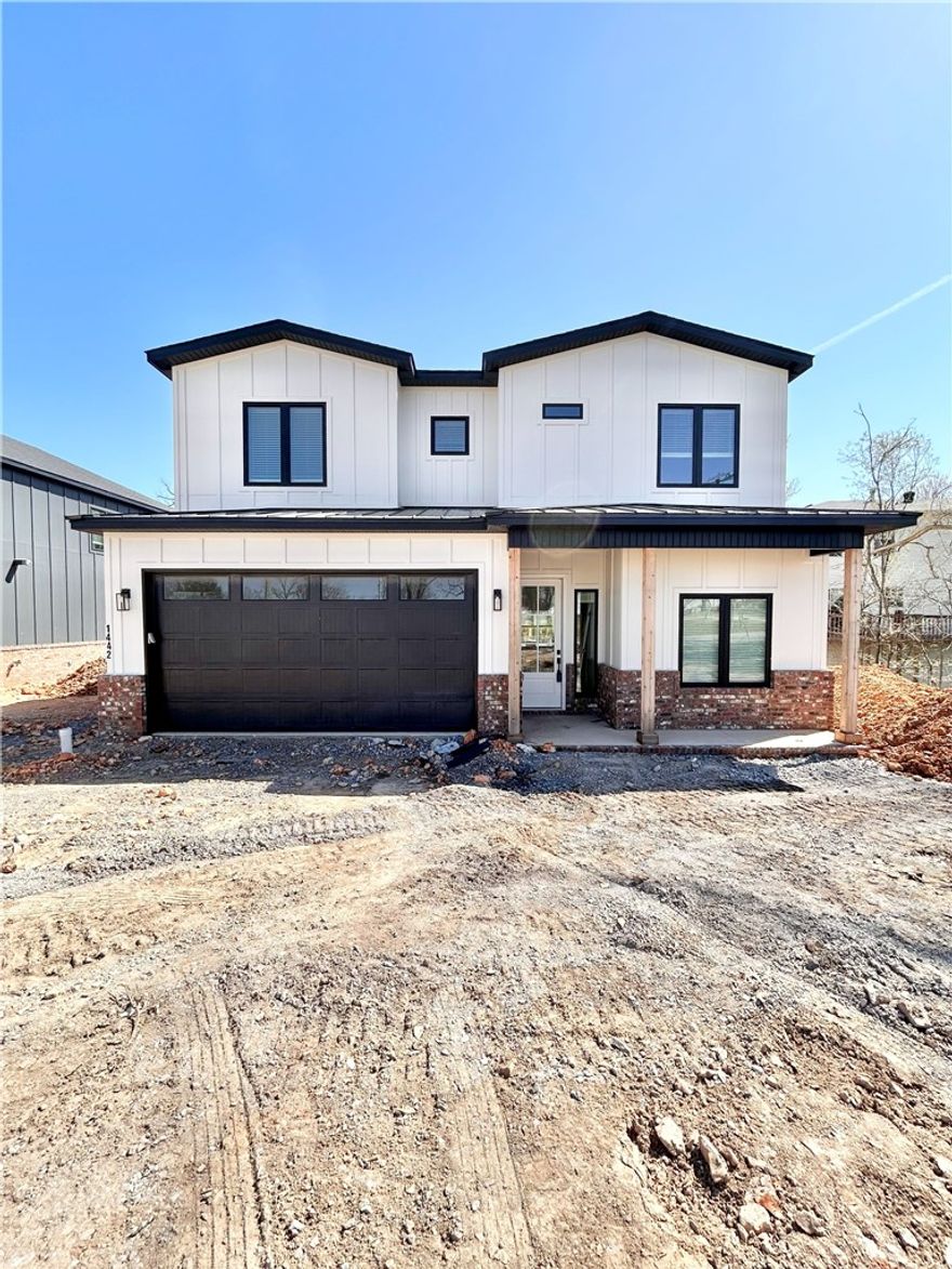 New construction home near downtown Bentonville! Just steps away from bike trails, schools, the Neighborhood Market, Airship Coffee, and provides easy access to Slaughter Pen Bike Park! This modern home features 4 bedrooms, 2.5 baths, and a versatile flex room. The primary bath boasts a custom tile shower and soaking tub. Open floor plan and an abundance of natural light throughout. Wood floors! (no carpet) The kitchen features floor-to-ceiling custom cabinets, 3 cm quartzite countertops, gas range, and a pantry. Oversized 2-car garage. Custom finishes throughout. As an added bonus, receive $3,500 towards buyer's closing costs when working with the builder’s preferred local lender!