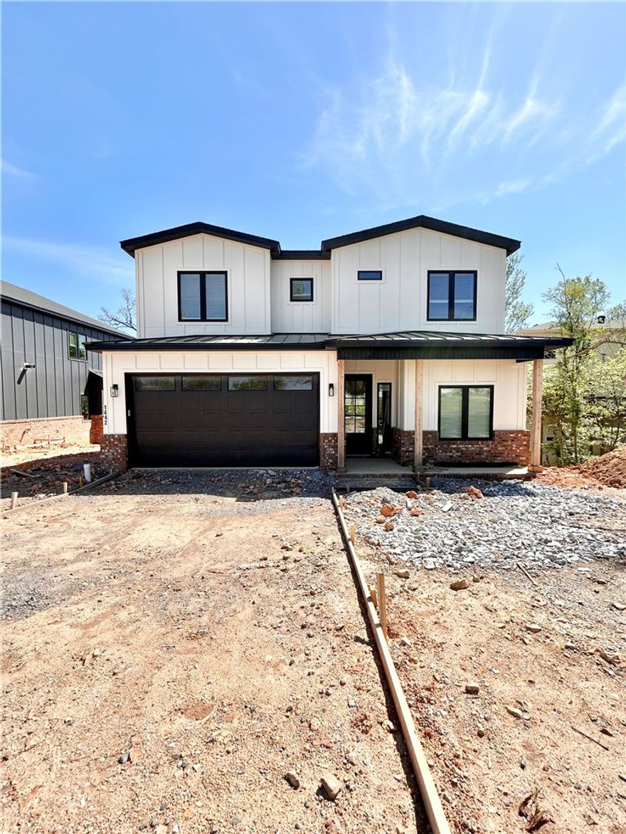 New construction home near downtown Bentonville! Just steps away from bike trails, schools, the Neighborhood Market, Airship Coffee, and provides easy access to Slaughter Pen Bike Park! This modern home features 4 bedrooms, 2.5 baths, and a versatile flex room. The primary bath boasts a custom tile shower and soaking tub. Open floor plan and an abundance of natural light throughout. Wood floors! (no carpet) The kitchen features floor-to-ceiling custom cabinets, 3 cm quartzite countertops, gas range, and a pantry. Oversized 2-car garage. Custom finishes throughout. As an added bonus, receive $3,500 towards buyer's closing costs when working with the builder’s preferred local lender!