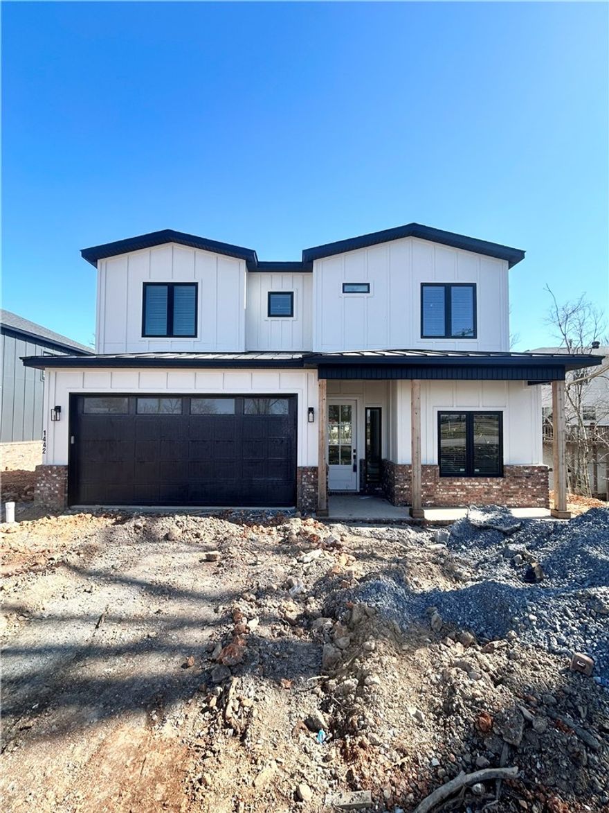 New construction home near downtown Bentonville! Just steps away from bike trails, schools, the Neighborhood Market, Airship Coffee, and provides easy access to Slaughter Pen Bike Park! This modern home features 4 bedrooms, 2.5 baths, and a versatile flex room. The primary bath boasts a custom tile shower and soaking tub. Open floor plan and an abundance of natural light throughout. Wood floors! (no carpet) The kitchen features floor-to-ceiling custom cabinets, 3 cm quartzite countertops, gas range, and a pantry. Oversized 2-car garage. Custom finishes throughout. As an added bonus, receive $3,500 towards buyer's closing costs when working with the builder’s preferred local lender!