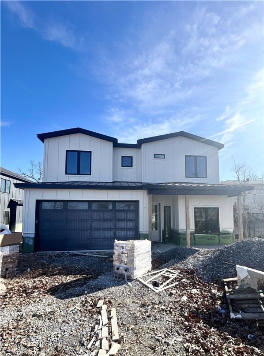 New construction home near downtown Bentonville! Just steps away from bike trails, schools, the Neighborhood Market, Airship Coffee, and provides easy access to Slaughter Pen Bike Park! This modern home features 4 bedrooms, 2.5 baths, and a versatile flex room. The primary bath boasts a custom tile shower and soaking tub. Open floor plan and an abundance of natural light throughout. Wood floors! (no carpet) The kitchen features floor-to-ceiling custom cabinets, 3 cm quartzite countertops, gas range, and a pantry. Oversized 2-car garage. Custom finishes throughout. As an added bonus, receive $3,500 towards buyer's closing costs when working with the builder’s preferred local lender!