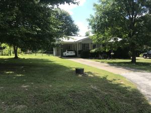 Don't let this cozy 3 bedroom 2 bath starter home pass you by. This home features a covered patio, carport, storage building with electric, as well as a 30x30 detached 2 car garage and sits on a large fenced lot. Central A/C unit, and the metal roof on the house and detached garage are less than 5 yrs old. Natural Gas furnace with secondary wall heater.