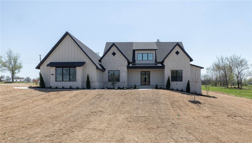 Absolutely stunning new construction home in Tontitown’s newest Deer Valley S/D!!  3,444 heated and cooled sq ft includes 4 bedrooms (of which all are on the main level), 3 full and 2 half bathrooms, open eat in kitchen to oversized living room, beautiful floor-to-ceiling stone surround fireplace, dining room, incredible butler’s pantry, bonus room, laundry, and mudd room.  Amenities are in abundance and include wide plank white oak hardwood floors, soft close cabinet doors and drawers, designer tile selections even in the tub surrounds, 2” blinds on all windows, tankless hot water heater, surround sound, built in security, mudd room lockers, attic storage, sprinkler system, and a 3 car side load garage with zero entry into the home AND a 220 outlet!  This fantastic home is situated on 1.44 acres and is zoned for Har-Ber High School!!
