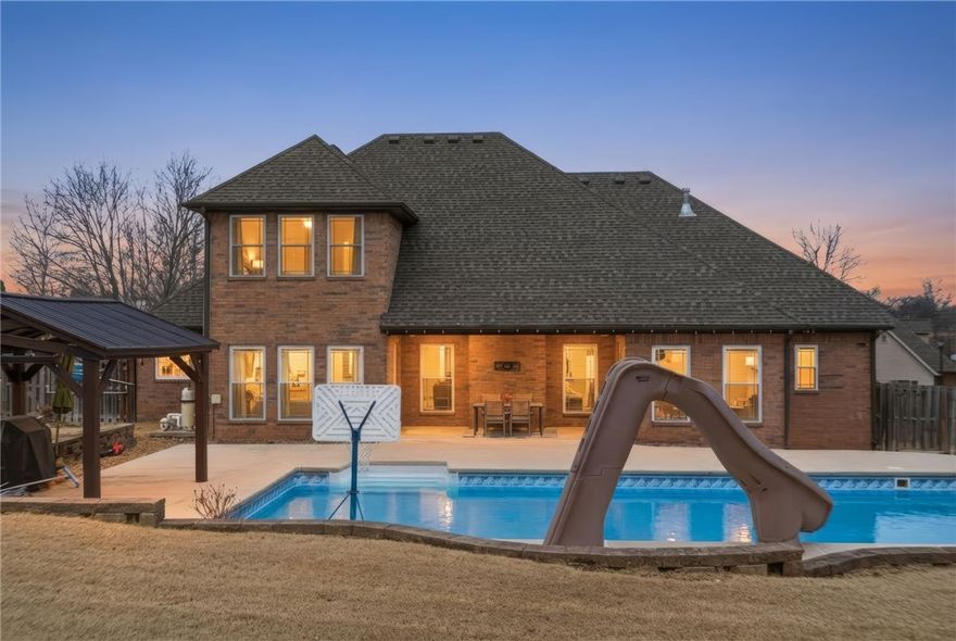 Here is your opportunity to own this amazing home only minutes from U of A, parks, shopping, and trails.  You will fall in love with the kitchen that is cooks' dream, with double ovens and large island you can host cookie baking parties, family gatherings, or friends get togethers, and there is plenty of space for dinning, entertaining, or just enjoying company of your loved ones.  Once your guests see the pool in the backyard with a large pergola, your only problem will be to get everyone to leave.  At the end of the day you can relax in your private retreat with a soaker tub and separate patio entrance.  While you enjoy the peace, the rest of the family can be having fun in their rooms on 2nd floor.  There is even an office if you work from home or bring work home.  The only thing this home is missing is new owner. 

Preferred Lender Incentives Available!