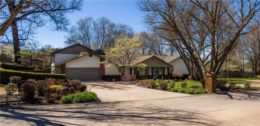 Welcome to your dream oasis nestled on nearly an acre of lush landscape! This magnificent estate boasts 5 bedrooms, 4.5 baths, & an array of living spaces including living room full of natural light, well-appointed kitchen, formal dining, study, plus versatile game room & den. Primary suite offers sitting area, en suite bath, & access to outdoors. Spacious utility features sink & pass-through cabinetry, ideal for keeping essentials easily accessible. Retreat to upstairs great room for leisure time or relaxation. Enhanced with 3 indoor fireplaces & abundant built-ins, every corner exudes warmth & character. Outside, discover a resort-style haven featuring a pool, complete with slide & diving board, and a charming pool house with full bath & storage with overhead door. As the sun sets, gather around the cozy outdoor stone fireplace or indulge in the inviting hot tub. With open-air sitting areas thoughtfully scattered throughout the botanical garden-like yard, you'll find plenty of spaces to unwind & soak in serenity.