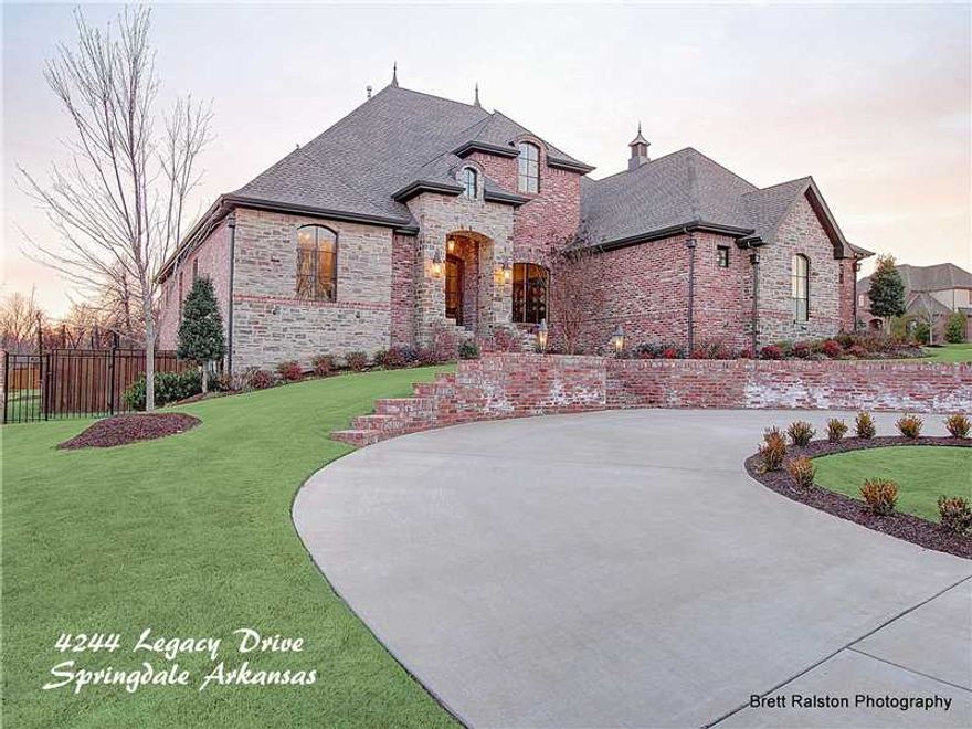Stunning Estate built on oversized lot in the prestigious and gated Heritage Hills Subdivision. This sprawling 6800 sq ft home features 6 bedroom, 7.5 baths, chef's kitchen with high-end appliances, hardwood flooring, high cathedral ceilings with beams,2 laundry rooms, and a basement with kitchen, bonus room and full bath. The property also includes a beautiful circle drive, heated in-ground gunite pool, and a 522 sq ft private entry guest quarters with additional bedroom, bath, kitchenette, and den.
