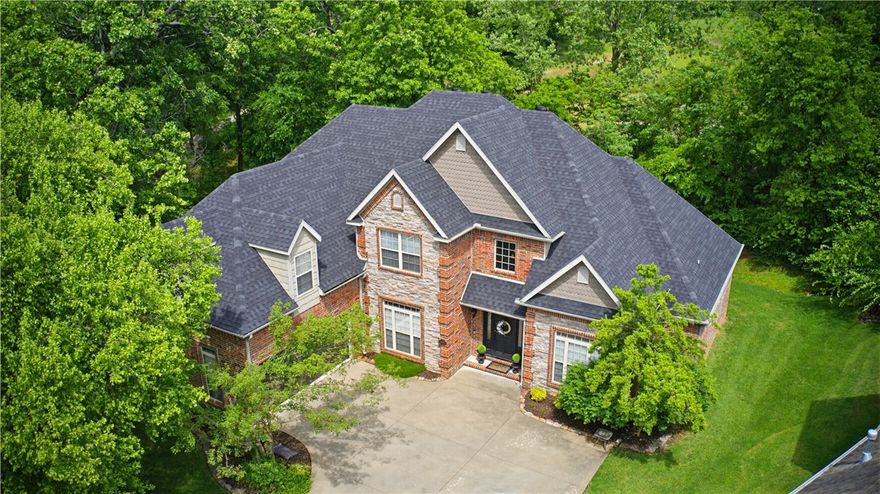 Elegant 5BR/4BA residence in sought-after Covington Park, offering a thoughtfully designed split floor plan and exceptional functionality throughout. A welcoming foyer opens to both a formal living area and a dedicated formal dining room with a gas fireplace —ideal for hosting and entertaining.
The kitchen is designed for everyday living and gatherings, featuring a gas cooktop, double ovens, generous pantry, and a light-filled eat-in dining area.
The private primary suite is tucked away on the main level,  an additional en-suite bedroom with two secondary bedrooms, and a dedicated office—offer flexibility without compromising privacy.
Upstairs, a spacious bonus/game room, bedroom, and full bath provide an ideal retreat for guests or additional living space.
Outdoor living is equally inviting, with a pergola covered back deck overlooking the backyard-perfect for relaxing or entertaining.
Recent updates include a new roof (2021) and two HVAC units (2022). * Additional Office and Bonus Room