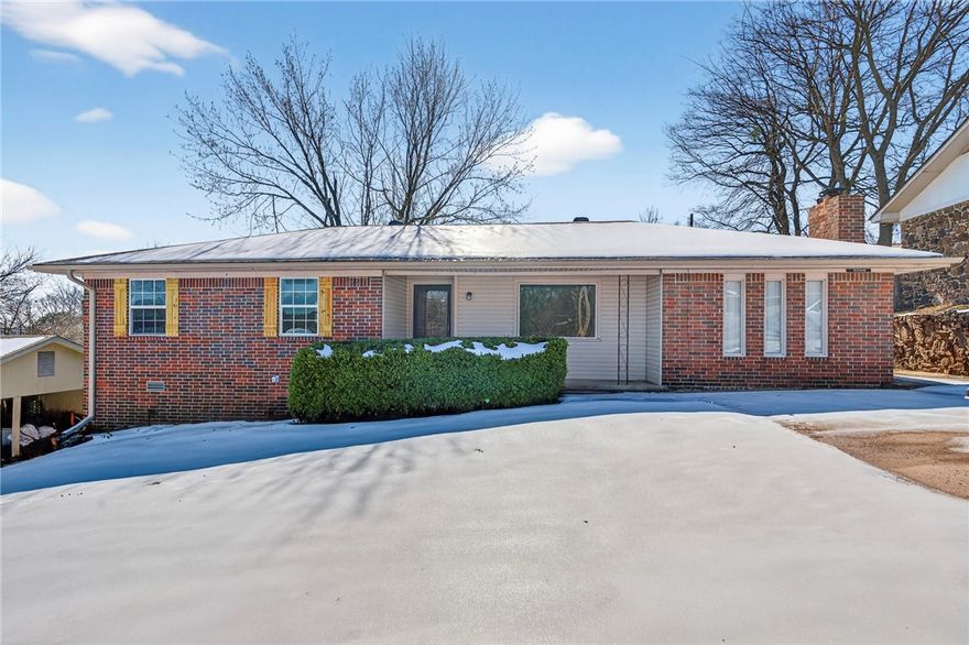 Welcome home to this well-maintained three bedroom, two bath property in an established Van Buren neighborhood. Fresh interior paint, updated lighting, new flooring, and a new roof make this home move-in ready. The living room opens seamlessly into a den featuring a cozy gas log fireplace with built-in shelving, creating a warm and inviting space for everyday living or entertaining. The kitchen is conveniently located near the laundry room, which includes a walk-in pantry offering excellent storage. Enjoy outdoor living in the fenced backyard with a covered patio, perfect for relaxing or hosting gatherings, plus a storage building for added convenience. Located near Van Buren City Park with walking trails around Lake Cap Bedell, frisbee golf, the Boys & Girls Club, and nearby schools. Centrally located with quick access to I-40 and I-540, and just minutes from shopping and dining throughout Van Buren, Arkansas.