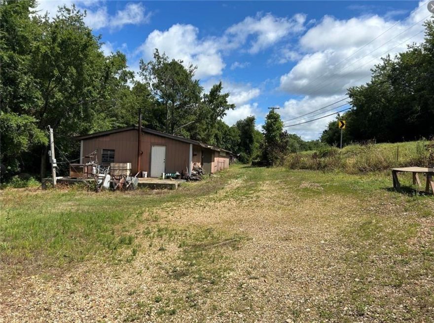 HWY 392 Frontage with Unlimited Potential  This property featured 24x86 Framed building that could be used for Multi Purposes.  Water Electric, and Phone on site