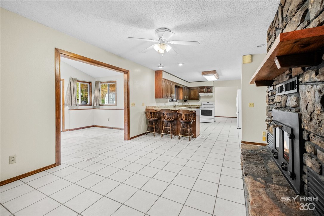 Home still has lots of original charm but has many modern updates including 2 inch granite in the kitchen and no carpet! The roof was replaced in 2017 and a brand new HVAC system and all new ductwork was installed in 2016. A glasstop electric range (3 years old) and new flooring throughout, the house has TONS of storage space. Looking for cabinet space? You have to see this kitchen and the additional storage built-ins in the formal living room, the laundry room and pantry/storage! The sellers have left their raised beds with deer fencing in the front - they grew all their own vegetables! The back yard has a great flat area (hard to find in Bella Vista) and the treed POA area behind serves as a buffer between the house and Chelsea. There's also a storage shed (if you need more storage) on top of storage in the garage. The living room is quite large, but you may want to spend most of your time in the hearth room having coffee in front of the wood fireplace, or the bonus room with skylights). Open house Sunday 2-4.