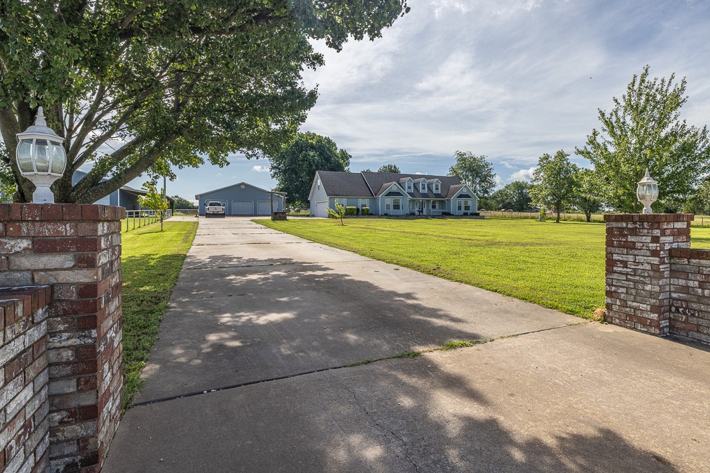 Spacious 4Br-3Ba-2 car attached garage home peacefully located on 17.65 acres of pasture just outside of Lincoln. Enjoy the sunrises and sunsets from this beautiful home with primary bedroom & guest bedroom on main level. Large spacious kitchen with granite countertops & loaded with cabinets. Living room with new tile & remote-controlled gas log fireplace with blower vent. Primary bedroom ensuite bath has a whirlpool tub, walk-in closet, walk-in shower, & double vanity. Upper level has 2 bedrooms & 2nd living space with kitchenette area (great floor plan for kids or extended family situation). Covered patio. Horse & cattle ready: 40x56 barn with stalls, working pen & chute, 30x66 hay barn, hay fields/pastures, loafing sheds & metal pipe & rod fencing/cross fencing. An additional 40x40 detached 3 bay garage. 40x60 shop with overhead doors large enough to accommodate RV parking. Water & electric available on separate meters & existing septic in the east pasture behind the house. Just outside Lincoln city limits.