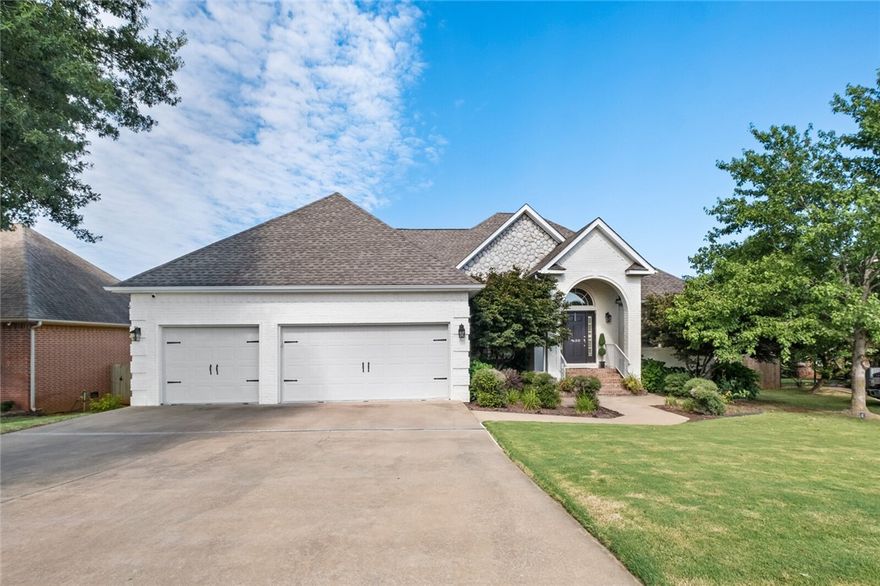 Beautifully updated 4BR/3.5BA home in a prime Fayetteville location just off Porter Road with quick access to I-49. Main level features wood floors, updated modern lighting, formal dining room, comfortable living room with gas fireplace, & a kitchen with granite countertops, stainless appliances, & an eat-in dining area. A designated home office adds convenience, while the primary suite offers a tray ceiling, double vanity, & jetted tub. The walk-out basement provides flexible living space, & the 3-car garage offers ample parking & storage. Fully owned solar panels add energy efficiency throughout the home. The fully privacy-fenced backyard is a true highlight—professionally landscaped & designed for both relaxation & entertaining. Enjoy a custom in-ground gunite pool with rock water feature, new deck with bar overlooking the pool, covered patio, & multiple seating areas perfect for gatherings or quiet evenings outdoors. All this in a location close to Fayetteville’s trails, mountain biking, & nearby amenities.