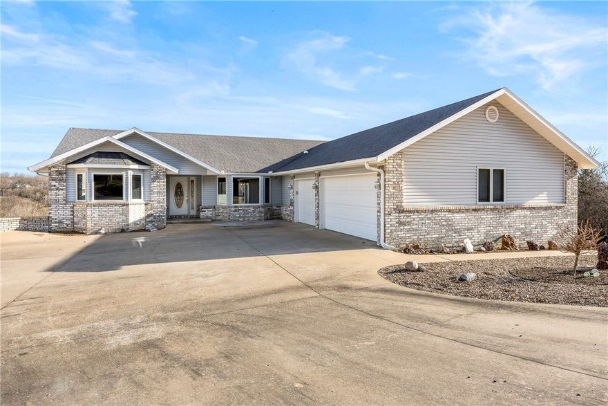 Need space ?  A  25 ‘ x 44 ‘  flex area with full wall of display cabinets, an oversized three car garage, and a 560 sq ft workshop headline this custom built one-owner home with a view located minutes from Scotsdale Golf Course, Loch Lomond, Tunnel Vision Trail, Walmart and Rte 71. Split floor plan. Front bedroom has a bay window and rear bedroom opens to the screened porch. Pocket door can make this area a guest suite. Primary has an adjoining den/sunroom and bath with dual vanities.  The treed area behind the house is POA common land for extra privacy.  Very usable rear yard and an adjacent cleared lot with easy topo gives you great outdoor options. Propane furnace 2014 - roof and WH 2016 - deck painted 2025