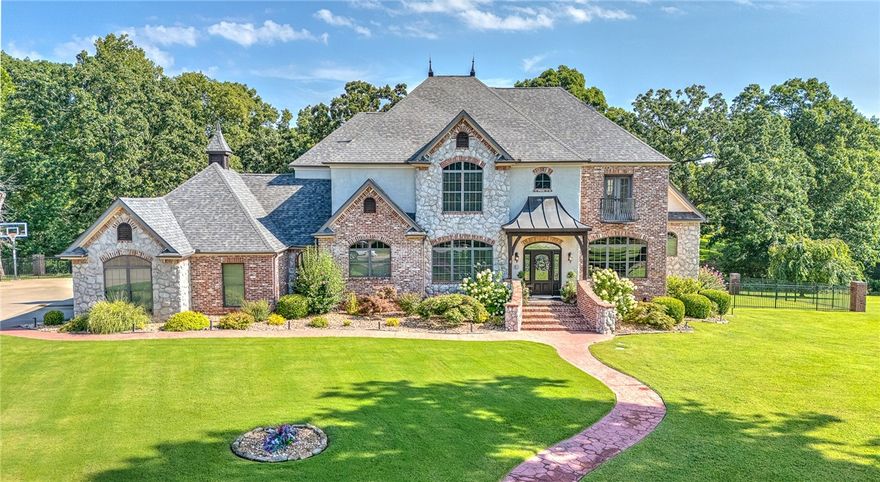 Welcome to your dream home in Bentonville’s prestigious Talamore Subdivision! This stunning residence offers a warm, inviting atmosphere with spacious, private living areas perfect for quiet evenings or lively entertaining. Featuring hand-scraped wood floors, large windows with abundant natural light, and a grand staircase in the entryway, this home exudes elegance. The luxurious primary suite includes direct access to a back deck, complemented by a pergola, cabana, and a privately situated gunite pool for outdoor relaxation or cooking. Conveniently located near Downtown Bentonville, Walmart Home Office, XNA, and Coler Creek, this gem provides easy access to all Northwest Arkansas offers. Schedule a showing today—this is a must-see!