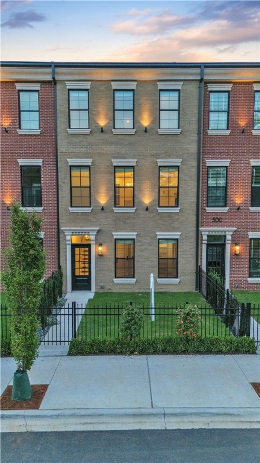 Step into the epitome of luxury and elegance at Oak One, where these Bostonian-classic inspired brownstones redefine upscale urban-living in downtown Bentonville. The Skyline II (3br, 3.5ba, 2813sqft, 2-car garage) exemplifies unparalleled craftsmanship and attention to detail, from the majestic cast stone and classic brick exteriors to the private green space courtyards. Designed for discerning tastes, these homes feature herringbone hardwood floors, towering solid-core custom doors, and bespoke high-end finishes including 24k-gold plated light fixtures and a stunning 1000-light teardrop chandelier. Indulge in the pinnacle of convenience with touches such as Hansgrohe faucets/shower-heads, high-end smart toilets (w/ bidet feature) & mirrors, heated towel racks, and fine appliances throughout. Enjoy a lifestyle of sophistication mere steps away from some of Bentonville's most iconic landmarks such as the Ledger, Pedaler’s Pub, Skylight Theater, the adjacent bike trail and more!