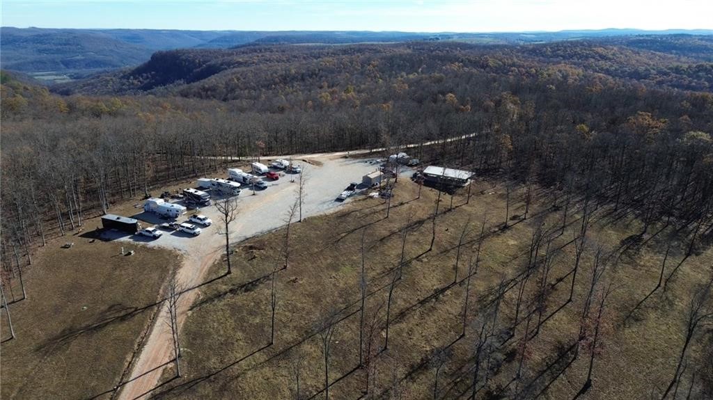 Arkansas Ozarks RV Park & Cabins with Room to Expand! Escape to the Arkansas Ozarks with this unique RV park and cabin retreat near the iconic Buffalo River. Featuring 9 RV slots, 3 cozy cabins, and a shared pavilion area, this property offers stunning mountain views, scenic ATV trails close, hunting spots, and a beautiful waterfall for guests to enjoy. With underground utilities already in place, there’s ample room to expand, making it a fantastic investment opportunity. Whether you envision adding more RV slots, additional cabins, or new amenities, this property is ready for growth. Guests will love the convenience of nearby world-class canoeing, fishing, and hiking, all while enjoying the tranquility of this nature-rich location. This is the perfect turn-key retreat for adventurers, nature lovers, or investors looking to own a piece of Ozark paradise. Don’t miss this opportunity to create your dream getaway—schedule a showing today!