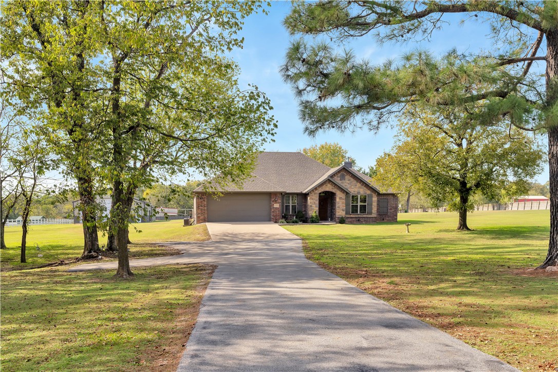Enjoy peaceful country living with this charming 3-bedroom, 2-bath home on over 3 acres. The interior offers custom built-ins, a spacious pantry, granite countertops, a wood-burning insert fireplace, central vac, and a whole-home generator. The 10ā7ā x 30ā screened-in porch overlooks a beautifully landscaped yard and fenced backyard with an electric fenceāperfect for pets and outdoor relaxation. The property also features an impressive shop thatās partially heated by space heaters and cooled by a window unit, with a kitchen area, bathroom with shower, sink, cook stove hookup, RV parking, water connection, and septic hookup for sewer dump. A 4-bay pole barn provides additional storage for vehicles, tools, or equipment. With a thoughtful layout and plenty of amenities inside and out, this home combines comfort, function, and privacy in a beautiful rural setting while keeping you close to town conveniences.