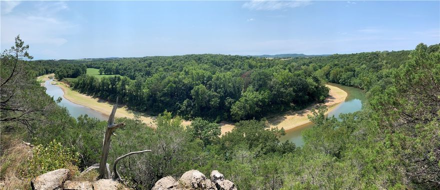 The Grand View! Beautiful farm with amazing Kings River views and frontage. 3288 square foot Brick home with 5 bedrooms and 3 baths has been updated with new flooring and paint. 2 screened porches, large sun room adds additional living space, 2 car garage, and 2 car carport. 45 acres of pasture currently houses 25 head of cattle. Pipe fenced and cross fenced, hay barn, 40x60 heated shop, storage building, and grand old red barn. Water to all the pasture is run in freeze proof line. This property is very efficient with 36 solar panels and a Hardy wood burning furnace in addition to central heat and air. Property conveys with New Holland tractor with finish mower and a 4 seater Kabota side by side. The water! 1,100 feet of Kings River frontage. This section of the river is rated #4 Nationally for Small Mouth Bass fishing. Full size road leads to the river for easy access. Plenty of cleared space for another home or cabins. 2 stocked ponds, one with a bridge to the island and home to a very large catfish! Must see!