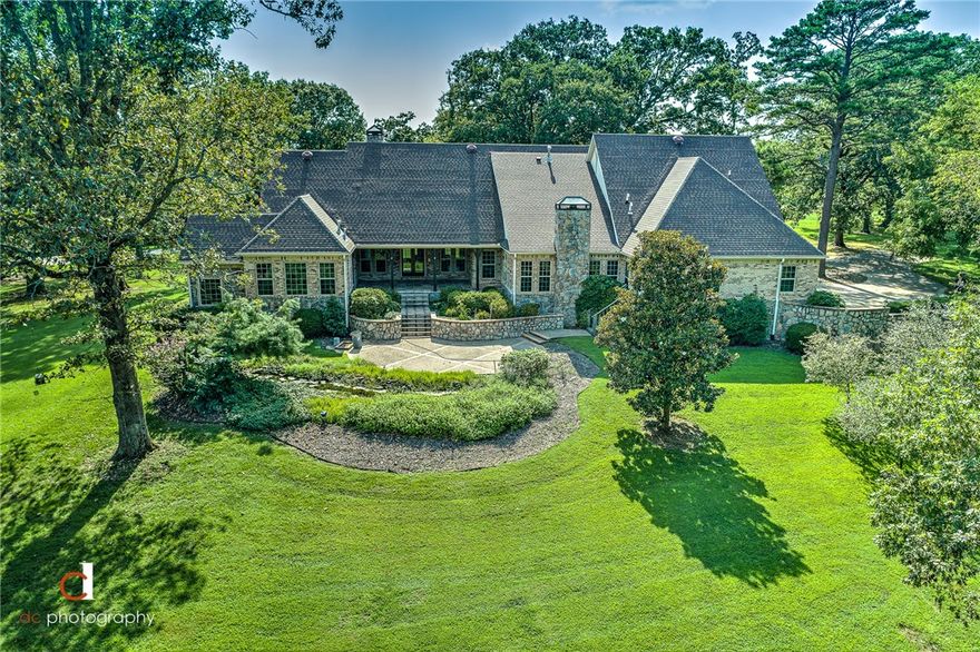 Beautiful Craftsman style home in the prestigious Talamore subdivision.  Large chef's kitchen with commercial grade stove, oversized pantry, hearth room and eat-in area. Kitchen is perfect for entertaining as it is open to the large hearth room that has a built in entertainment hutch and a cozy fireplace.  Formal dining room with built-in china hutch.  Great room/Billiard room is complete with a wet bar and fireplace.  The spacious master bedroom on the main level has a fireplace, built in bookcases and an extra room for an office or sitting area.  The Master bath has a whirlpool tub and walk-in shower. There is a guest bedroom (or 2nd master bedroom) and full bath on the main level.  The upstairs has two large bedrooms, each with its own full bath.  Large walk in attic storage.  4 car garage with storage room/ workshop space. Beautifully landscaped tree covered lot in cul-de-sac.