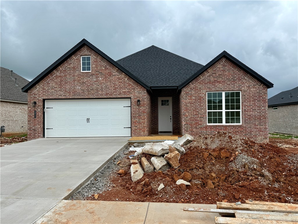 Pea Ridge boasts a variety of activities, all set against the town's scenic beauty. With abundant outdoor recreation, a strong community atmosphere, and affordable living, Pea Ridge stands out as one of Northwest Arkansas' top emerging communities.Step into the Falcon Plan, where LVP flooring spans the living spaces and every detail is thoughtfully designed, from tiled showers to premium 3CM granite countertops throughout. The utility room, with striking decorative tiles, offers direct access to the primary bedroom, making laundry effortless. The primary bedroom serves as a serene retreat, featuring exposed wood beams and large windows that fill the space with natural light. A cozy nook in the living room adds functionality, ideal as a study.The open-concept layout seamlessly connects the kitchen, dining, and living areas, flowing into a covered back patio that offers serene views of your tree-lined lot. For a limited time rates starting at 4.99% OR $7,500 from builder & up to $4K from preferred lender.