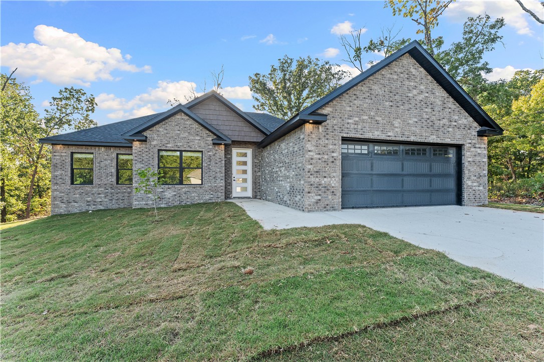 Are you looking for a new construction home with wow factor? This home definitely has it! A true 3 bedroom home, plus an office, built by one of the most reputable builders with a one year builder warranty, $5K in builder incentives and up to $3K preferred lender credit you don't have to look any further. Enjoy all that Bella Vista has to offer with the close proximity to Loch Lomond and water sports, the amenities of the Branchwood Recreation Center, Golf, Tennis, hiking, biking and more. Luxuriate in the high end finishes with custom paint, a huge pantry and mud room, large garage, beautiful light oak floors throughout and gorgeous private back deck. Builder also includes propane tank (not all builders do!). Split floorplan, landscaped yard - this home will knock you off your feet.