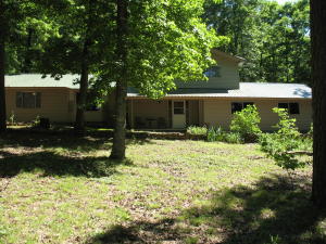 HOUSE AND 8.62 ACRES ADJOINING NATIONAL FOREST ON THE BACK OF PROPERTY WITH WILD LIFE REFUGE WITHIN WALKING DISTANCE.3 bedroom 2 full bath with beautiful bamboo and maple flooring. This Pet free ,smoke free home offers a central H&A system that is less than 2 years old and still under warranty.Metal Roof that is less than 5 years old.Kitchen Bar and double kitchen sinks.Built in book cases.Garage with a tool room work area. Don't let this one get away!!!
