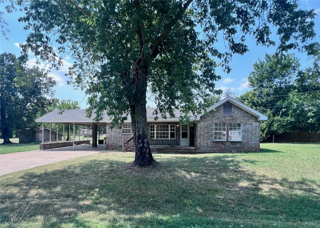 Motivated Seller-- Lots of Natural Light in this 3 bedroom 2 bath home--3rd bedroom does not have a closet. Home located on .82 acres, level and it has plenty of room for play or gardening. There are spacious updated bathrooms with good water pressure. The only gas is the heating system. There is extra parking with the attached 4 car carport. A detached 24x18 shop is on a slab. Close to Kibler City Park. A short drive to Alma or Van Buren. Selling "AS IS" Third bedroom does not have a closet.
