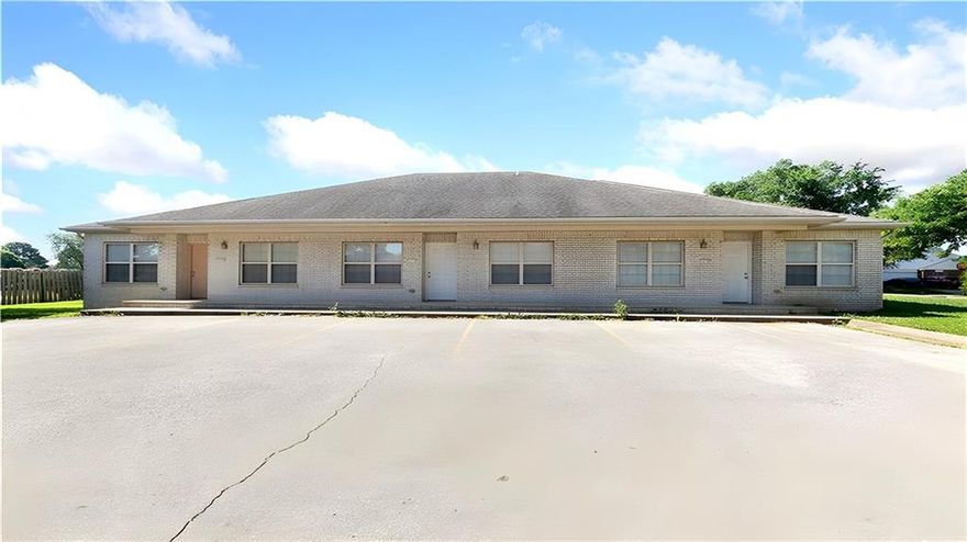 Exceptional Investment Opportunity in Fayetteville, AR! Strategically positioned just off I-49 on a private street, just 3 miles from the University of Arkansas and minutes from dining, shopping, and entertainment. Each unit boasts low-maintenance all-brick exteriors with solid steel frame construction, energy-efficient spray foam insulation, and comes with two dedicated parking spaces. All units feature 2 beds/2 baths with primary suites offering full attached baths and walk-in closets. Enjoy outdoor living on generous back patios enclosed by privacy fencing. Units include refrigerator, washer and dryer, plus recent updates like new HVAC systems. This triplex offers flexible investment strategies—rent all units long-term, explore lucrative short-term rental/Airbnb opportunities, or implement a combination approach. Don't miss this chance to secure your financial future! Property sold as-is. New AC unit on one unit!