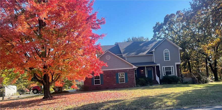 One Owner home on large corner lot with multiple storage buildings, trees and privacy, fenced improved garden, 3 or 4 bedrooms, primary suite and 2 other bedrooms and bath upstairs, downstairs bedroom 
could easily be office or library, oak hardwood floors in most of downstairs,  living room which has vaulted ceiling with windows, country flame fireplace ducted throughout house, formal dining with great views and natural light easily used for art or craft room, large kitchen with oak cabinets, two pantries, island, granite countertops, large breakfast room.  Laundry room is downstairs with chute from upstairs,
two water heaters, two ch/a units, deck on west side of house with great views of sunsets, exterior of house is brick and Truwood siding, roof replaced in 2025.  Half bath downstairs with easy access from garage and 4th bedroom --see attachment from owner of many details.