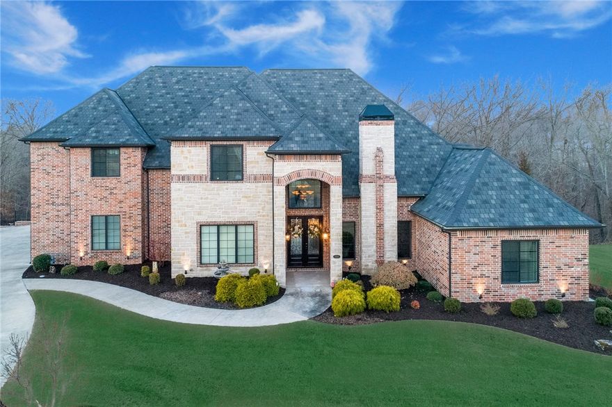 This 5050 Sq Ft home and 456 sq ft pool house sits on a 2.63 acre lot backing up to the woods in the highly desired Talamore Subdivision. Enjoy the large lot with covered outdoor living area, outdoor fireplace, built in gas grill, hot tub, custom heated guinte pool with a waterfall and a pool house! Perfect upscale kitchen with upgraded cooktop and refrigerator, living room open to the kitchen, study with gas fireplace and formal dining perfect for any occasion. Secondary bedroom downstairs is completely handicap accessible with custom ramps throughout the home. Custom trim work throughout, 4 garage bays, and hardwood floors throughout. Large bonus room with custom wet bar area, storage and tons of light streaming in. Full media room with projection screen, projector, and surround sound. Sq Ft reflects the main house and the pool house heated sq ft.