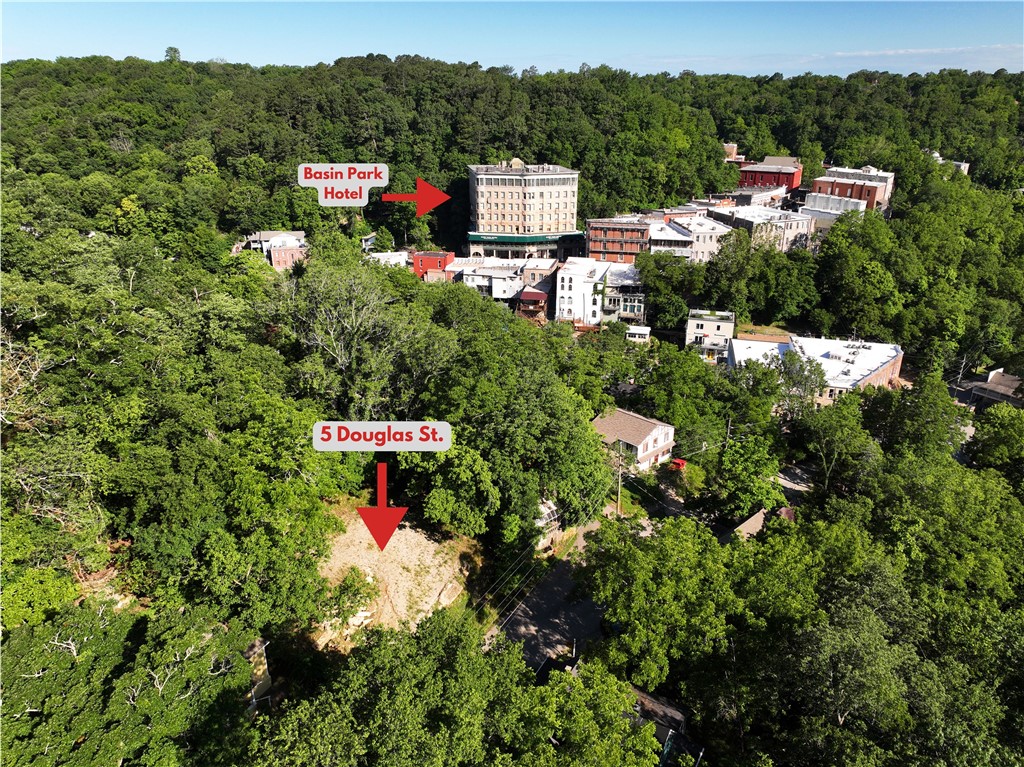 Imagine the possibilities!!! This fabulous, one of a kind lot is located in the heart of Eureka Springs, on one of the most desirable residential streets in town. Just a hop up from the festivities on Main St., you'll find this quiet, wooded lane, lined with historic homes that leads to the serenity of Little Lake Eureka. Two lots combined and truly a gem, this rare, flat property has been cleared for its next home and has all utilities at street. Enjoy this special community, full of amazing people, parades, shopping, art and dining and have the luxury to enjoy an easy walk to your tranquil retreat. If you want to live it up like a local, call today to learn more about this awesome property!!