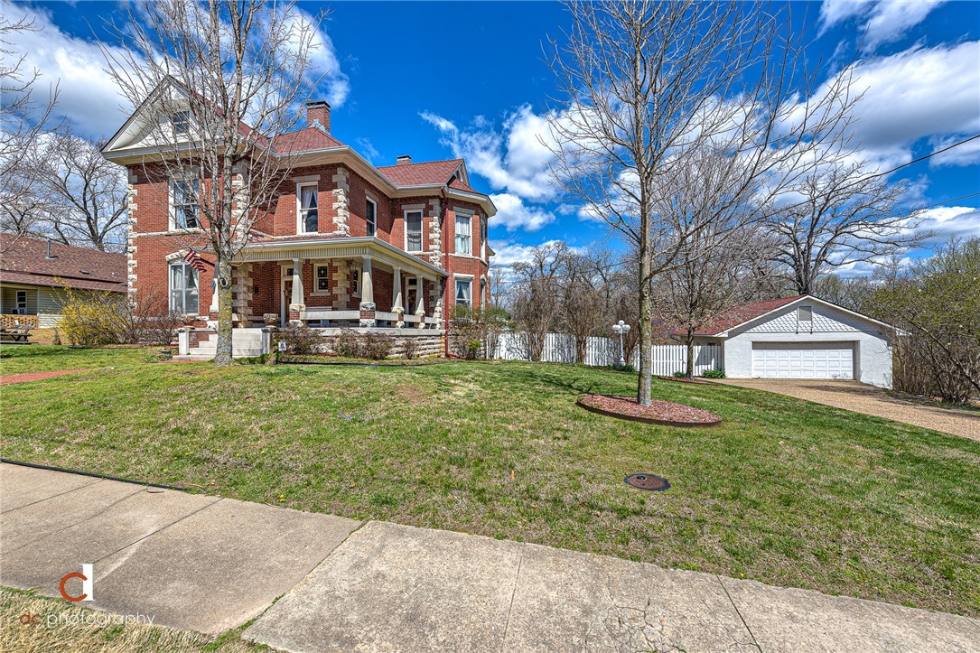 HISTORIC 1906 DOWNTOWN BENTONVILLE GEM located just one block from the Bentonville Square and Crystal Bridges Trail entrance! Own a piece of Bentonvilleās rich history located on a .44 acre lot directly across the street from the Benton County Administration offices and Razorback Greenway. Enjoy all the charm of a historic home with updated modern amenities. Beautifully maintained with custom additions and ornate stately Georgian detail throughout featuring 10 ft ceilings on the first and second floors. Third floor hosts a great studio apartment with modern finishes! Built by the owner of Carson Macon Apple Brandy Distillery that operated next door. This property is next door and across the street from Walton owned properties and zoned Downtown Edge which indicates many commercial opportunities. Just blocks from the new Walmart Home Office campus and within walking distance to shopping, eateries, entertainment, trails and more! National Historic Register property and important historic downtown landmark!
