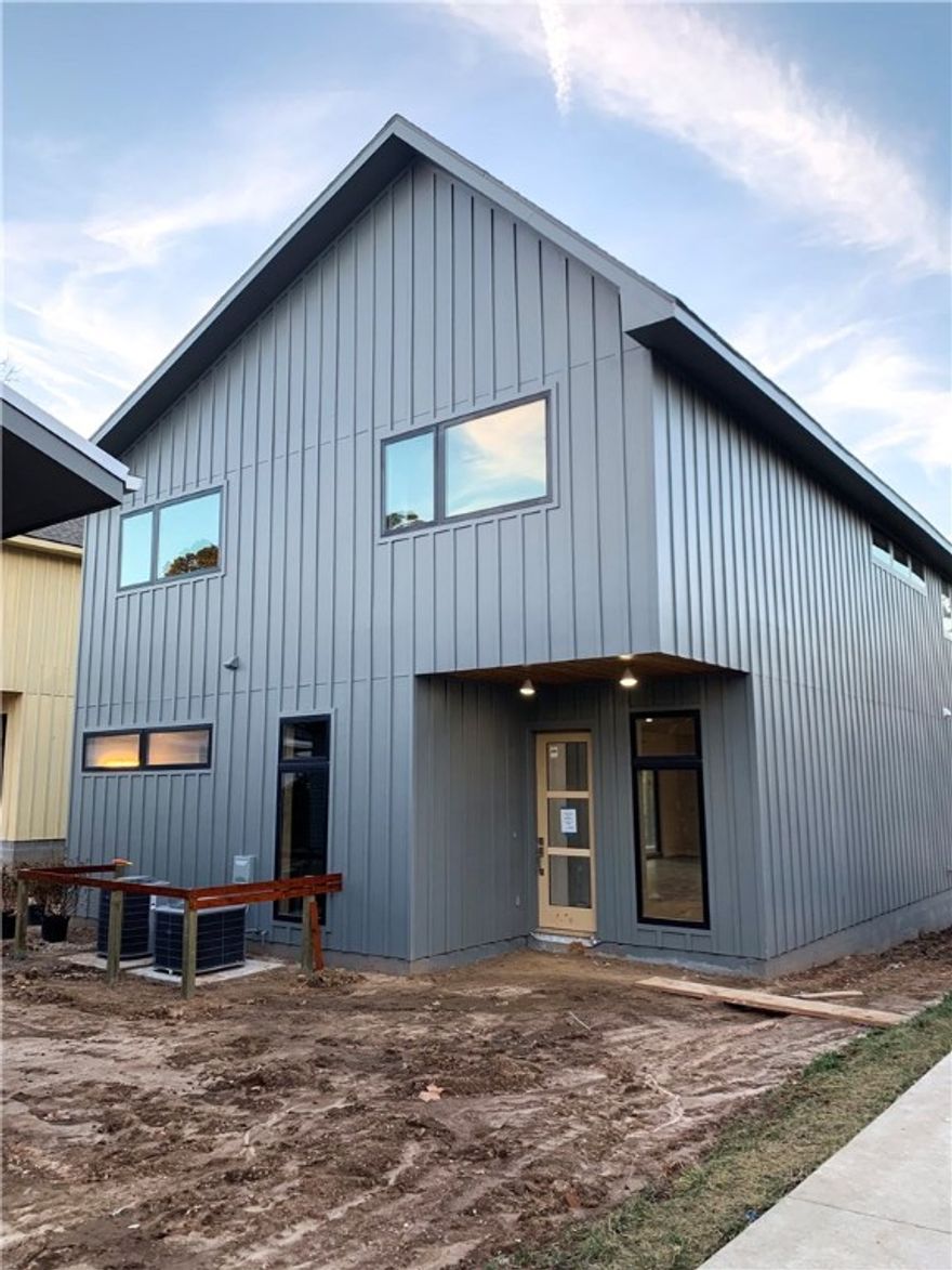 New construction home now complete. High end modern finishes with ample space for entertaining, including a 700 sqft deck, open floor plan, wood flooring, quartz counters, top of the line appliances and a 3 car garage! Close to Crystal Bridges, North Downtown Bentonville, Razorback Green Way and the Amazeum. Great dining options, entertainment, and access to nature. Larger backyard, compared to other lots in Downtown Bentonville. Agent is related to seller.