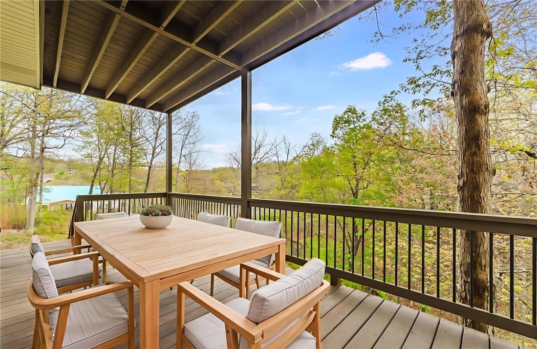 Privately located at the end of a quiet cul-de-sac, 16 Carole Rae Lane is an exceptional 1.8-acre property offering a rare opportunity to own a double lot directly on Lake Brittany. With a recently painted interior, this home has 4 spacious bedrooms, 3 full bathrooms, two living areas, two dining areas, and two full decks. To the left of the gorgeous front door and foyer, French doors lead to office space that allows for seamless work from home, while the formal dining room to the right sets the stage for memorable meals. A stunning double-sided fireplace serves the living room and casual dining area, creating a warm, inviting ambiance that flows effortlessly into the kitchen, with its granite counters, plenty of storage/prep space, tile backsplash, and stainless-steel appliances. Two bedrooms upstairs and two more downstairs have dedicated bathrooms. The living space on the sublevel has direct access to the lower patio and fire pit. Both decks overlook the lake and the path to the private boat dock.