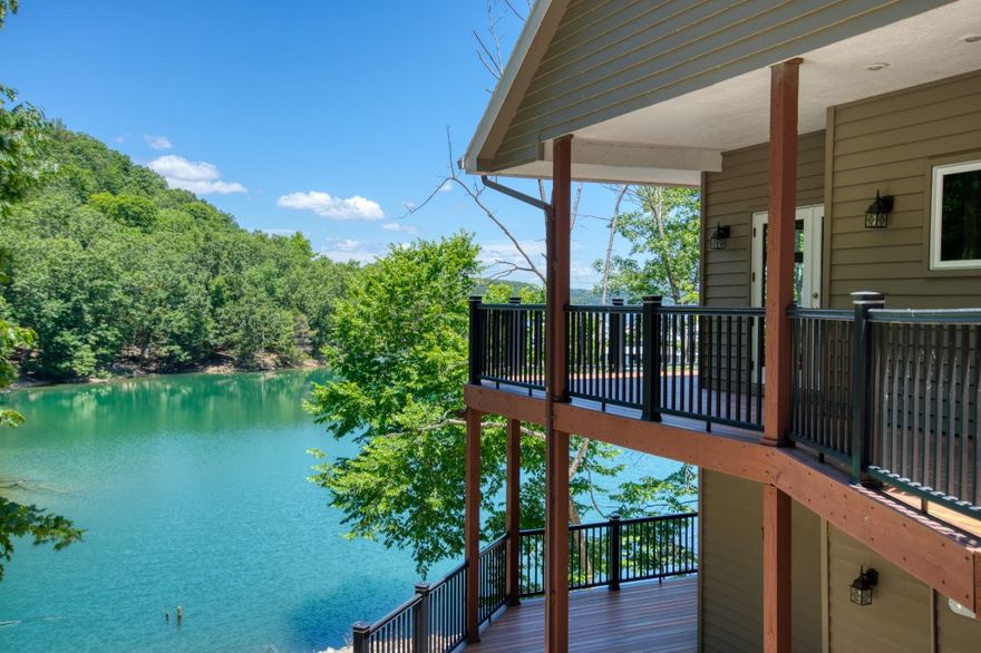 It’s hard to get closer to Beaver Lake than this! You can just about fish from the deck! The included slip in Starkey Marina is around a 3 minute drive from the house or a 30 second canoe paddle! This large home is in the middle of nature with mature trees, rock bluffs and 950’ of lake frontage on it’s 6 acres. If you need more land, the adjoining 6 acres is available with the house for an additional $50,000. Three large decks for plenty of room to entertain, a hot tub, fire pit, and a pool area with a pergola and outdoor fireplace. Two car garage and a second detached garage for more toy storage! The house has large windows everywhere and oversized rooms. The lower level has lots of room to relax and a huge storage area that could possibly be changed into more living space. This property’s Corps of Engineers take-line is in the water, it has full strength 5G cellular coverage, has it’s laundry on the main level, and the access roads are paved!