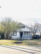 ROMANTIC WANTED: to appreciate this picturesque beauty from Yesteryear! Completely restored from floor to ceiling. Warm colors accent the refinished hardwood floors. Lovely kitchen with lots of charm, stained glass window, gas range, washer and dryer too. Both bedrooms have its own bath! Stained glass windows, 12 foot ceilings, crown moldings. Quiet location and convenient to the university, downtown and the nature trail. Sit on your covered front porch and enjoy the view of the U of O and down town Clarksville. New heat and air unit too. Call for you showing today!
