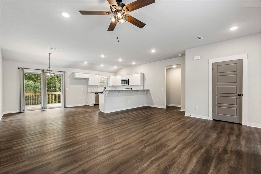 Welcome to the world’s mountain biking capital—where adventure meets comfort! This 2023 built home has barely been lived in and feels like brand new, designed with a split floor plan that makes everyday living easy. Step inside and you’ll love the open flow, high-quality finishes, and thoughtful details that make the space feel both stylish and functional. Move-in is seamless with gutters and custom blinds already in place. The kitchen is a dream with granite counters and a custom backsplash, while the primary suite offers a spa-like escape with its custom tile shower. Even better, a second parcel conveys, giving you a total of .65 acres—perfect for extra privacy, outdoor gatherings, or future plans. Location seals the deal: just minutes from the new mountain bike park, grocery store, and local restaurants in both NWA and MO. Here, you can live in style, surrounded by nature’s beauty, and enjoy a vibrant lifestyle that puts trails, dining, and community right at your doorstep.