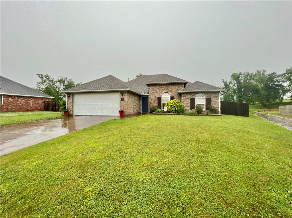 Discover this gem in the popular subdivision of Sienna Estates in Centerton! The property backs up to McKissik Park behind the home, walking distance to the splash pad, community fishing pond and trails. Subdivision also features a community pool, park, fitness room and clubhouse that homeowners can enjoy. Property sits on .30 acres and features 3 bedrooms and 2 bathrooms with a split floorplan. Kitchen includes pantry, stainless steel appliances and electric range. Kitchen opens to dining area and large living room with exposed wood beams gas fireplace and mantle that matches. Primary suite is oversized and has the same details shiplap, exposed wood beams and wood door. Primary bathroom has an ensuite that contains large whirlpool tub, stand up shower, extra storage and dual vanities. The back yard is spacious, open and has access to the back gate where you can cut thru to the new park and splash park. Raised planters have been added to grow perfect vegetables in the side yard. Perfect yard for a growing family!