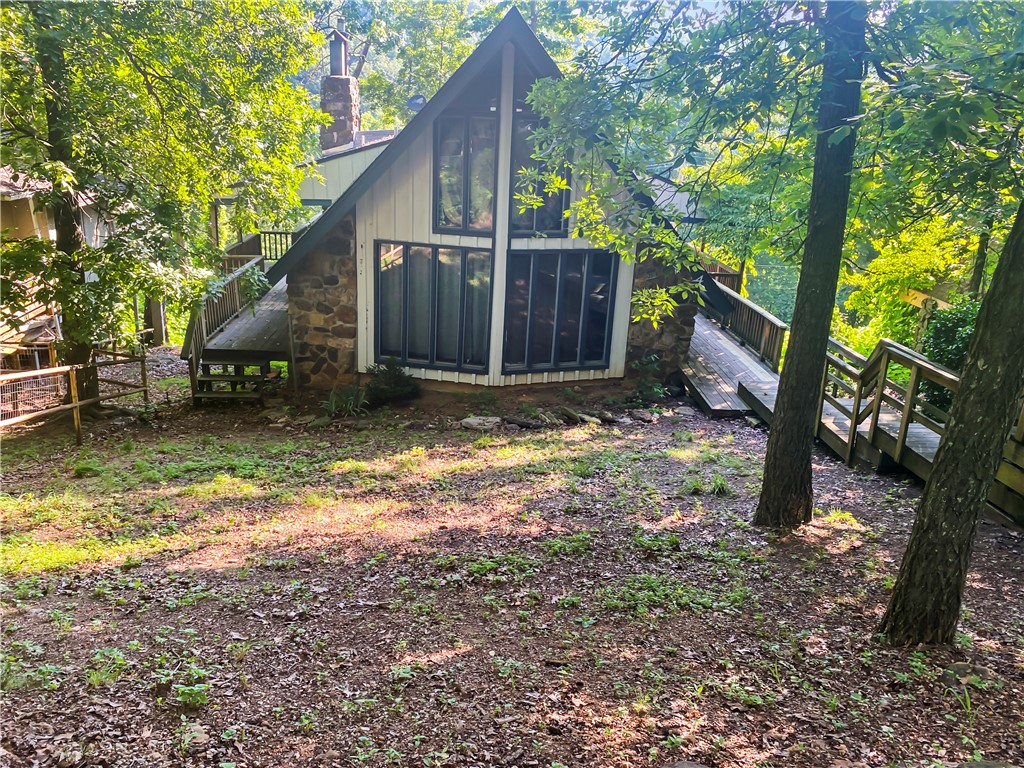 This very nice Chalet is located in the Ozark Mountains and Buffalo National River Park Region in beautiful Newton County, Arkansas. Located at historic Dogpatch and future home of Johnny Morris and Big Cedar's Marble Falls Nature Park development. This three level 3BR 2BATH 1919 SF A frame is located in the Marble Falls Community. It has a partially finished bedroom and full bath in the basement that could make it a 4BR 3BATH home. Abundance of decks/porch. Tile floors throughout. This is a great investment opportunity for a nightly or monthly rental or make it your home. Near the Ozark National Forest and just a short drive from Jasper, Harrison and Branson. This central location is convenient to the best swimming holes, hiking, canoeing, fishing, ATV riding and awesome other outdoor activities.