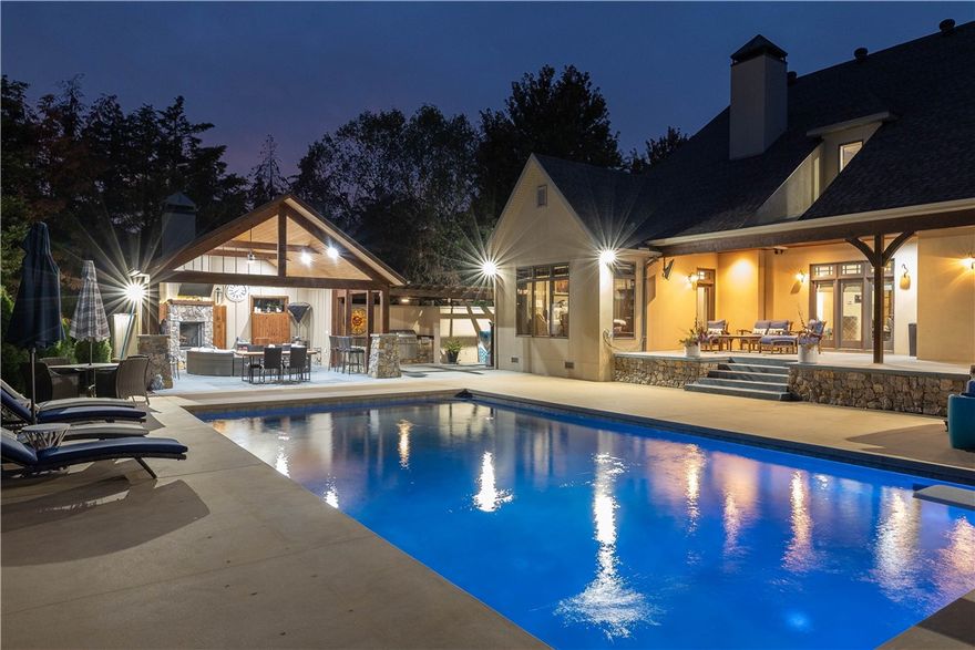 Step into luxury with this stunning 5-bedroom, 5.5-bath home in the gated golf community of Clear Creek. Custom built & remodeled by Mason Nall Custom Homes, this masterpiece sits on a spacious .70-acre corner lot. A grand double-door entry welcomes you into an open floor plan with elegant lighting, 5” walnut hardwoods & soaring beamed ceilings. Living room stuns with a floor-to-ceiling stone gas fireplace & French doors leading to the backyard. Chef’s kitchen boasts a quartzite island, soapstone countertops, stainless appliances & a butler’s pantry. Primary suite is a retreat with a jetted tub, walk-in shower & walk-in closet. Media/bonus room is on the main level & could be used as a 6th bedroom. Step outside to an entertainer’s dream—an in-ground heated gunite saltwater pool, covered patio, pavilion with wood-burning fireplace & pergola with outdoor kitchen. The spacious, fenced backyard offers ample room for relaxation. With private security & luxurious amenities, this home offers an unparalleled lifestyle.