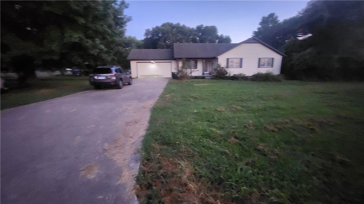 Here's your chance to live in the borderline of beautiful Rogers and Avoca. Well kept home features 3 BR/2BA + bonus room. Master bedroom features a walk-in closet and a walk-in shower. Open split floor plan with ample amount of storage throughout. Very quiet neighborhood. Covered front porch and back patio are great for entertaining. Backyard has almost 1 acre and a large workshop that's in great condition. The roof is in good shape. The HVAC system has yearly checkups and is in good condition.