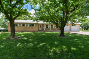 Perfect family home! Located 8 miles North of Harrison, AR and 26 miles to Branson, MO. This large ranch style brick home on nearly 2 acres has plenty of space for the whole family! The property has a barn with a hayloft, an attached two car garage, and a 12'X36' concrete slab for extra parking for RV or boat. The basement has more garage parking for the lawnmower or side-by-side! The home is on city water, but also has a private well that was functioning upon last usage. This home has central heat and air, and a backup wood-burning stove in the basement that is ducted throughout the home, and a wood burning insert in the dining room. The property is covered with fruit trees of many varieties; 12 apple trees, 2 pecans, a peach, pear, and large walnut tree. Call me today to see this home!