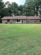 Very nice 3 bedroom 3 bath brick home on secluded 2 acres. Over 2,000 heated and cooled square feet it features large rooms with ample storage and closets. Updated kitchen and appliances, granite countertops, luxury vinyl flooring, roof less than 2 years old, storage building. Five minutes to Chamberlyne Country Club golf course. Fine schools, hospital and shopping less than ten minutes away. Thirty minutes to I-40. This charming convenient home is waiting for your ownership. $217,900.00