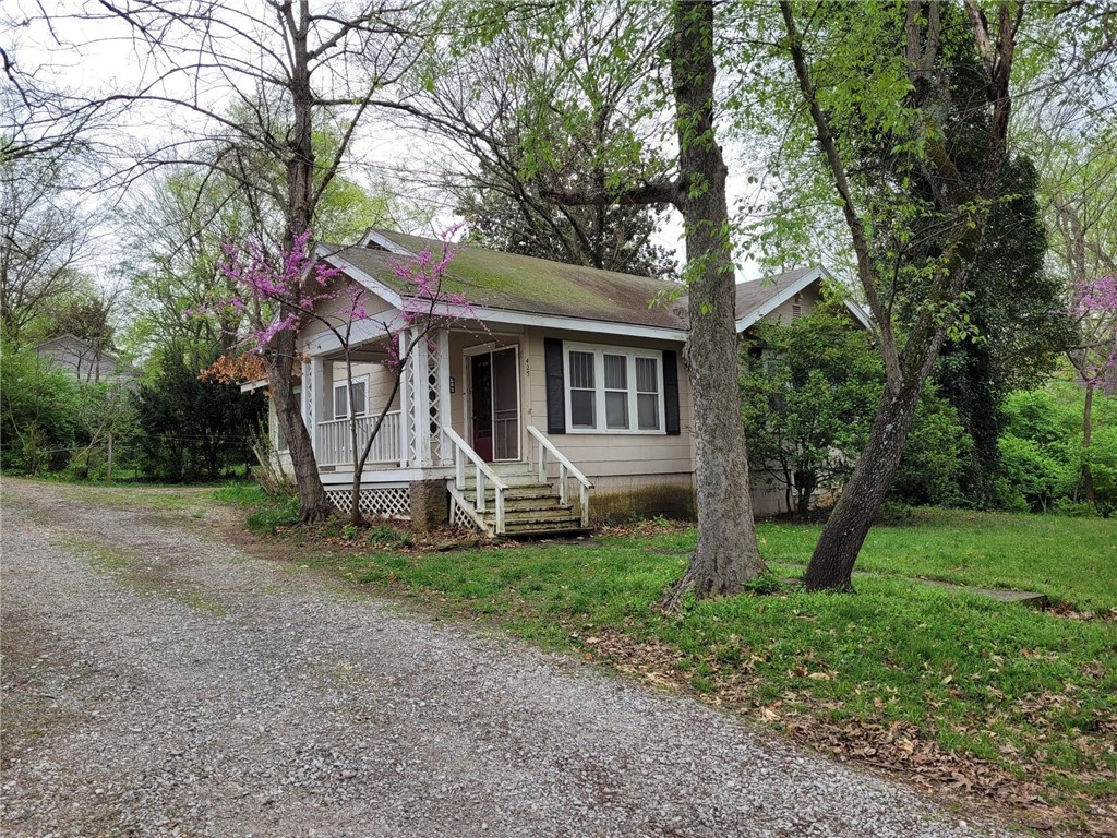 Very cute cottage style home in Historic area of Fayetteville. House has two bedrooms, one bath with claw-leg tub. Kitchen has dishwasher, vintage style gas oven/range, cabinetry, and refrigerator. In back is an attached carport and backyard is fully chain-link fenced. This could be a tear down to stud and remodel or a tear down depending on your purpose. Value is in the lot. Property sold as-is, where-is, no disclosure, no repairs. This Won't Last Long!!
