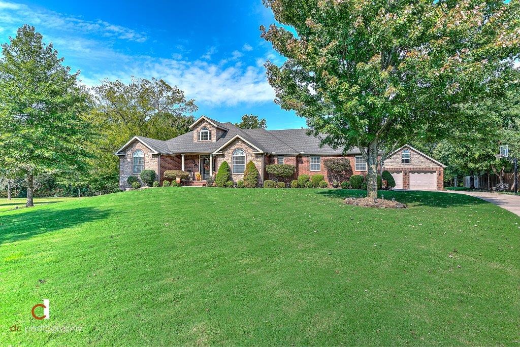 CUSTOM BUILT/ONE OWNER 5 BED/3 BATH BEAUTY LOCATED IN THE PRESTIGIOUS GLENBROOK SUBDIVISION IN THE HEART OF BENTONVILLE! Enjoy a peaceful 1.79 acre gorgeous park-like setting w/ creek that backs up to Memorial Park and is within walking distance to Crystal Bridges and the NEW Walmart Campus! Stunning interior just received a $100K total house remodel in 2018 & 2019. 3 living areas plus office, 3 fireplaces, 2 kitchens, new appliances, master & 2 bedrooms on main level, 2 bedrooms downstairs, formal dining, huge walk-out basement, 2 laundry rooms, granite throughout, 300 sq ft walk-in storage, 2 car attached and 2 car detached insulated garages plus 20 x 18 workshop garage in basement, gorgeous walnut stained real hardwoods! Mature trees, large deck and covered patio! SPECTACULAR PROPERTY INSDIE AND OUT!!