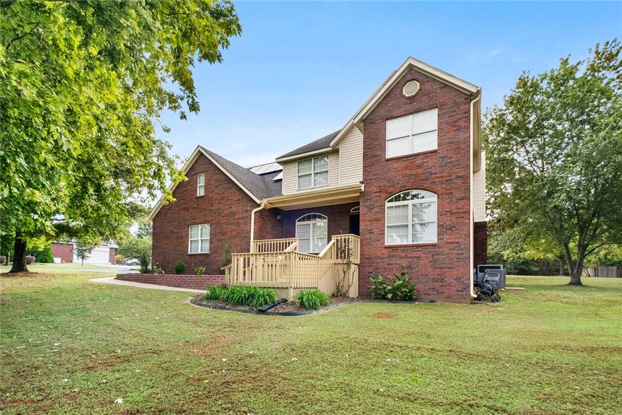 Nestled on 2 acres just minutes from Fayetteville, this beautiful 2-story home offers 4 bedrooms & a flex space which doubles as a bonus room or 5th BR, 2.5 baths, & over 2,900 sq ft of living space. The open kitchen features granite countertops, stainless appliances, & an eat-in breakfast area which flows into a warm living area with a wood-burning fireplace. The spacious primary suite includes its own fireplace & a newly remodeled bath with a custom walk-in shower. Recent updates such as a reverse osmosis water system, new garage door, new water softener, and new upstairs HVAC add peace of mind for the homeowner. Add'l features include solar panels & an encapsulated crawlspace, offering moisture control & energy efficiency. The expansive yard, garden space,  wood deck, & mature trees offer privacy & create an ideal setting for outdoor enjoyment & entertainment. With an attached 2-car garage & easy access to I-49, this property delivers the perfect balance of country serenity & city convenience. Pre-inspected.