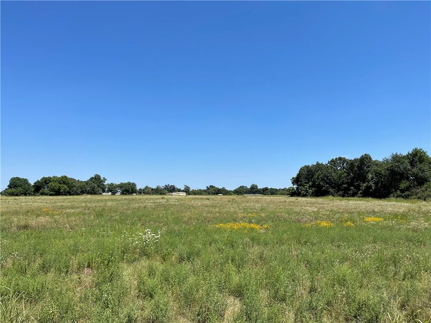 Extremely rare opportunity to get into a 33+ acre fully approved development. This is beautiful, level, clear, open, perfect development land. This subdivision has had the civil engineering done, been through planning and zoning, and passed with flying colors with the Board of Directors for the City of Siloam Springs. The drainage is all figured out and it is very well situated for development. Sewer drop is right where it needs to be for tie into city sewer. All utilities are very close on both the west and north sides. The development was designed for a mix of commercial and multi family development. Current plat has 28 duplex lots, a bunch of room for commercial, and additional room for apartments, townhouses, self storage, more duplexes or single family. Take our current plans or have them modified to suit your needs. This will sell fast!!