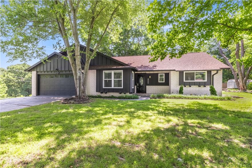 Beautiful home on over half an acre in one of Rogers’ most desirable neighborhoods! This beautifully updated property sits on a large corner lot with mature trees and a peaceful setting just steps from Lake Atlanta and the Razorback Greenway trail system. Location is unbeatable—only 1–2 minutes to downtown Rogers, with local shops, restaurants, and events close by. Lake Atlanta’s walking and biking trails, parks, and playgrounds are just around the corner, and Beaver Lake’s Prairie Creek Marina is only 5–6 minutes away. Inside, you’ll find gorgeous new floors, updated lighting, fresh paint, and a charming wood-burning fireplace that anchors the living space. The floor plan is inviting and functional, perfect for everyday living or entertaining.  This home offers a rare combination of nature, space, and city convenience. Homes like this are hard to find—don’t miss your chance to own a slice of Northwest Arkansas paradise! Agent owned.