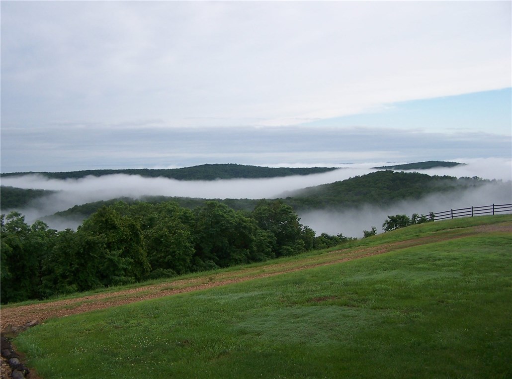 Cloud 9 Estate, located in the Ozark mountain range, sits a top of one of the highest peaks at 2240’ with 360-degree views as far as the eye can see. This astonishing 3750 sq/ft home and 685 sq/ft guest cabin was built above and beyond luxury. No need to worry about neighbors because this 80 Acre property is bordered on 2 sides by Untied States Wildernesses and 1 side by National Forest. Commercial appliances in Kitchen. Open floor plan. Uninterrupted views of the Ozarks from every room.