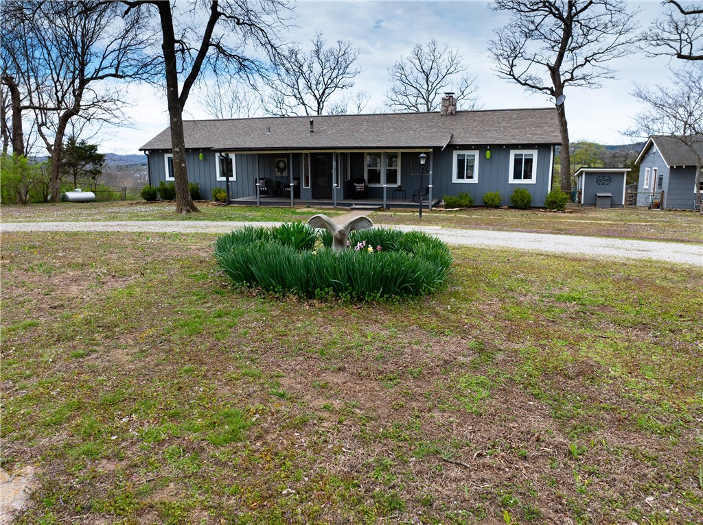 This one-story, traditional styled home w/4-bedrooms, 2-baths sits on 3.2 acres with incredible Kings River. views. Large kitchen w/ample sized pantry, propane stove & ice-maker line. Home features: entry foyer access, sunroom & large screened-in back porch. Additional features: wood-burning stove, hardwood flooring, new carpeting & vinyl plank flooring. Home improvements include: roof replacement/2020, new HVAC system /2023, well bladder replacement 2025, deck addition/2022 and new garage doors. Entire home interiors and exteriors have been repainted. The home has a large circular driveway, a detached 3-car garage with workshop, large RV shed, landscaped front yard, front door porch, fenced-in backyard with a double and three single entry gates and spacious yard waiting for your green thumb. All major systems are in good working order. A caretakers tiny home (approx. 400 Sq. Ft.) is also part of property being offered. Seller is offering buyers $4,000 for a home improvement allowance w/acceptable offers.
