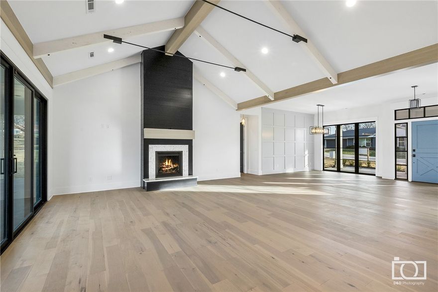 In the heart of Fayetteville near Wilson Park and Downtown Proper. New 5 bedroom, 4.5 bath home on estate size lot. Custom built in 2022 by Martin Building Group and designed by Wendy Martin Living combines coastal architecture with timeless traditional style. Roof top patio terrace provides gorgeous sunset views. Built for indoor and outdoor living from the dutch door, to the back patio, you'll find designer details throughout this split floor plan with open concept. Vaulted beams, chef's kitchen with butlers pantry, and 5 star energy efficiency. Floor to ceiling fireplace is a stunning focal point visible from the dining space and kitchen for a relaxing open feel. Perfect for entertaining with casita opening to covered patio.